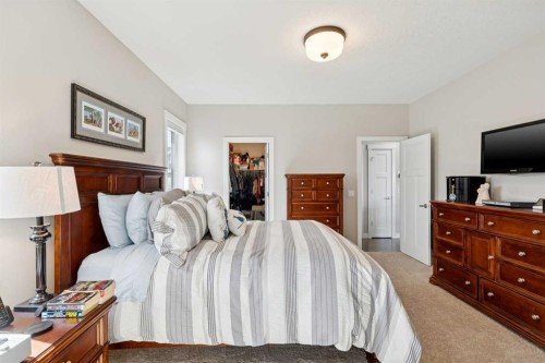 101 Sheep River Crest, Okotoks, AB - Indoor Photo Showing Bedroom