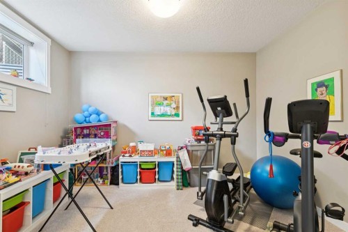 101 Sheep River Crest, Okotoks, AB - Indoor Photo Showing Gym Room