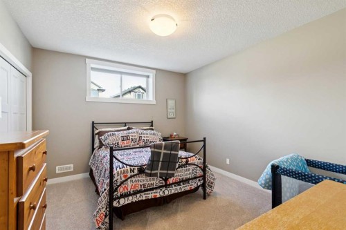 101 Sheep River Crest, Okotoks, AB - Indoor Photo Showing Bedroom