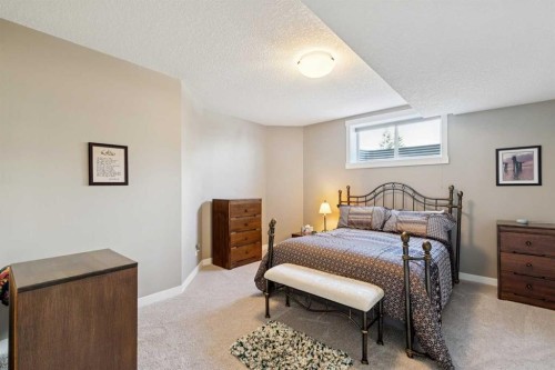 101 Sheep River Crest, Okotoks, AB - Indoor Photo Showing Bedroom