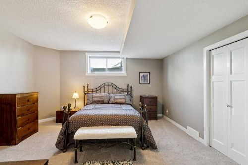 101 Sheep River Crest, Okotoks, AB - Indoor Photo Showing Bedroom
