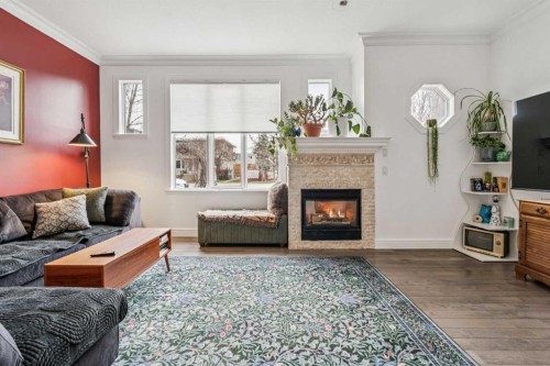 2211 Bowness Road Nw, Calgary, AB - Indoor Photo Showing Living Room With Fireplace
