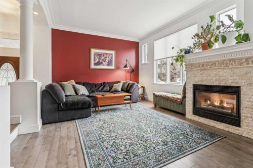2211 Bowness Road Nw, Calgary, AB - Indoor Photo Showing Living Room With Fireplace
