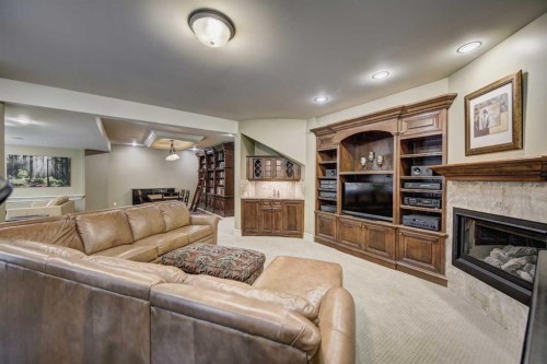 2626 Evercreek Bluffs Way Sw, Calgary, AB - Indoor Photo Showing Living Room With Fireplace