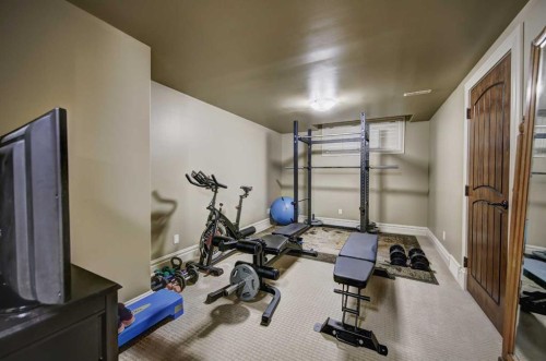 2626 Evercreek Bluffs Way Sw, Calgary, AB - Indoor Photo Showing Gym Room