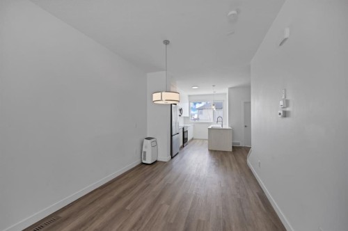 105-101 Panatella Square Nw, Calgary, AB - Indoor Photo Showing Other Room