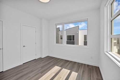 105-101 Panatella Square Nw, Calgary, AB - Indoor Photo Showing Other Room