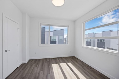 105-101 Panatella Square Nw, Calgary, AB - Indoor Photo Showing Other Room
