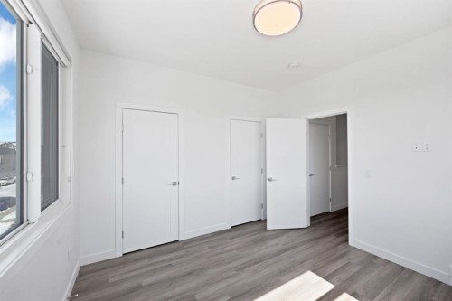 105-101 Panatella Square Nw, Calgary, AB - Indoor Photo Showing Other Room