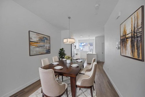 105-101 Panatella Square Nw, Calgary, AB - Indoor Photo Showing Dining Room