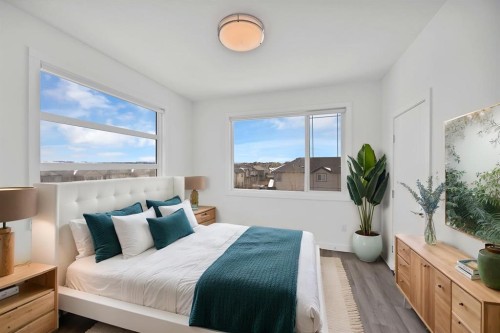 105-101 Panatella Square Nw, Calgary, AB - Indoor Photo Showing Bedroom