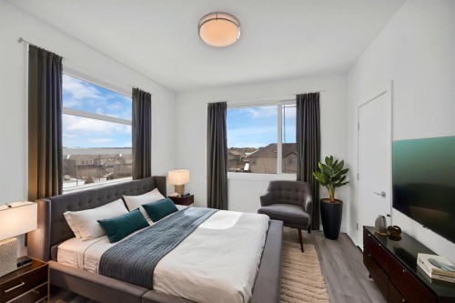 105-101 Panatella Square Nw, Calgary, AB - Indoor Photo Showing Bedroom