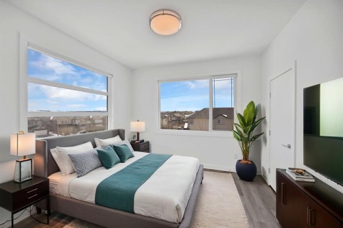 105-101 Panatella Square Nw, Calgary, AB - Indoor Photo Showing Bedroom