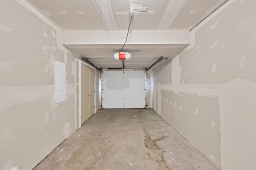 105-101 Panatella Square Nw, Calgary, AB - Indoor Photo Showing Garage