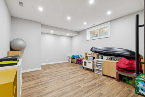 27 Elgin Terrace Se, Calgary, AB - Indoor Photo Showing Living Room With Fireplace