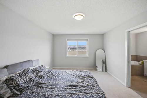 186 Carringvue Park Nw, Calgary, AB - Indoor Photo Showing Bedroom