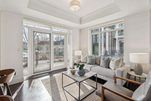 103-211 Quarry Way Se, Calgary, AB - Indoor Photo Showing Living Room
