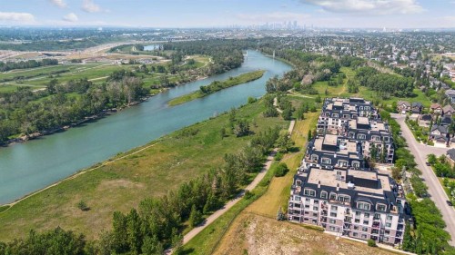 103-211 Quarry Way Se, Calgary, AB - Outdoor With Body Of Water With View