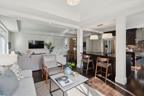103-211 Quarry Way Se, Calgary, AB - Indoor Photo Showing Living Room