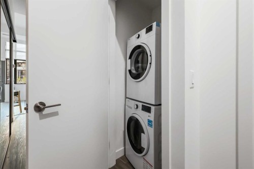 Package #2-730 2 Avenue Sw, Calgary, AB - Indoor Photo Showing Laundry Room