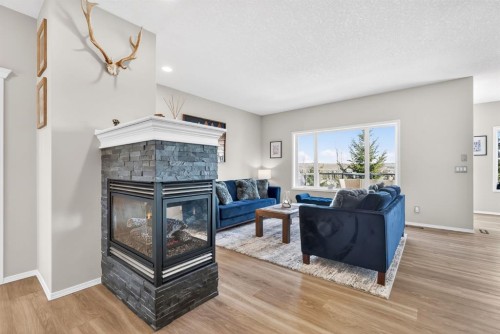 44 Bow Ridge Drive, Cochrane, AB - Indoor Photo Showing Living Room With Fireplace