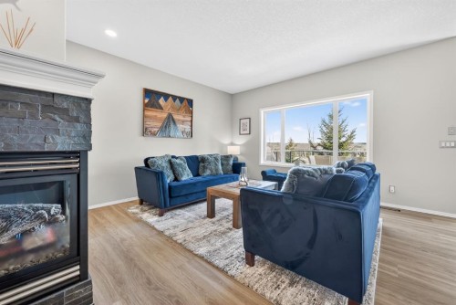 44 Bow Ridge Drive, Cochrane, AB - Indoor Photo Showing Living Room With Fireplace