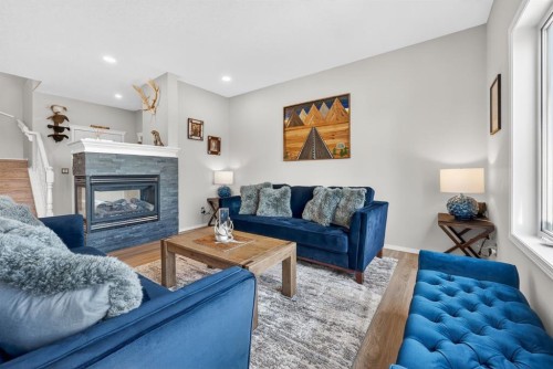 44 Bow Ridge Drive, Cochrane, AB - Indoor Photo Showing Living Room With Fireplace