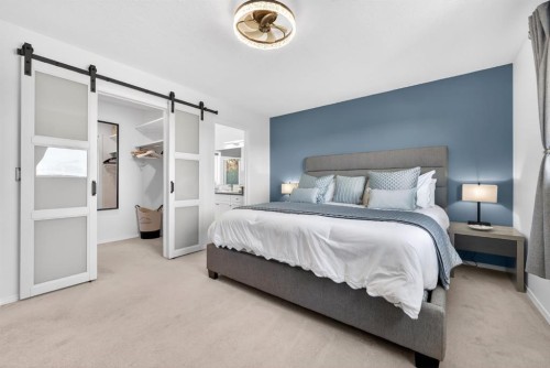 44 Bow Ridge Drive, Cochrane, AB - Indoor Photo Showing Bedroom