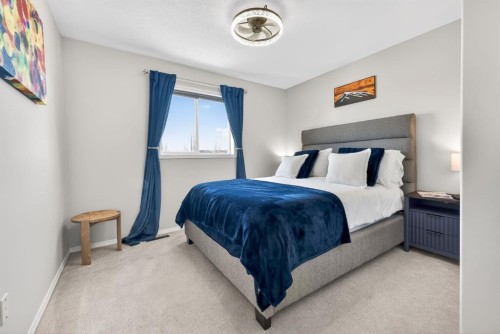 44 Bow Ridge Drive, Cochrane, AB - Indoor Photo Showing Bedroom