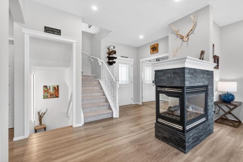 44 Bow Ridge Drive, Cochrane, AB - Indoor With Fireplace