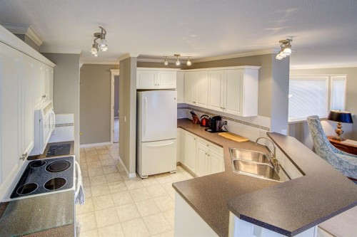 26 Skyline Crescent, Claresholm, AB - Indoor Photo Showing Kitchen With Double Sink