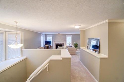 26 Skyline Crescent, Claresholm, AB - Indoor Photo Showing Other Room With Fireplace