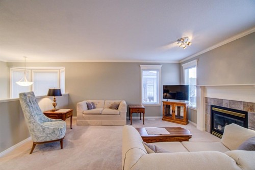 26 Skyline Crescent, Claresholm, AB - Indoor Photo Showing Living Room With Fireplace
