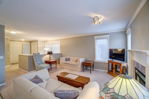 26 Skyline Crescent, Claresholm, AB - Indoor Photo Showing Living Room With Fireplace