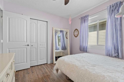 125 Monteith Drive Se, High River, AB - Indoor Photo Showing Bedroom