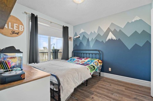 125 Monteith Drive Se, High River, AB - Indoor Photo Showing Bedroom