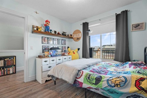 125 Monteith Drive Se, High River, AB - Indoor Photo Showing Bedroom