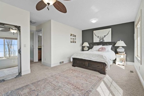 125 Monteith Drive Se, High River, AB - Indoor Photo Showing Bedroom