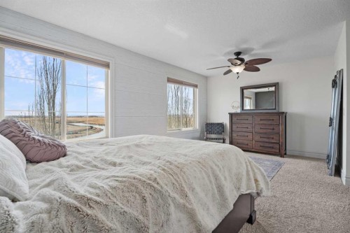 125 Monteith Drive Se, High River, AB - Indoor Photo Showing Bedroom