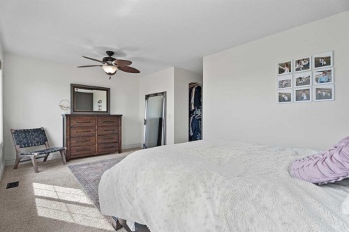 125 Monteith Drive Se, High River, AB - Indoor Photo Showing Bedroom