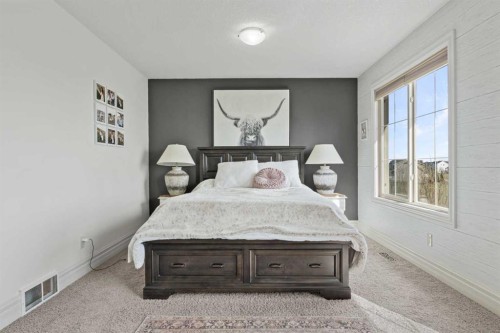 125 Monteith Drive Se, High River, AB - Indoor Photo Showing Bedroom