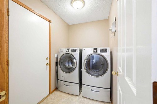 129 Arbour Ridge Circle Nw, Calgary, AB - Indoor Photo Showing Laundry Room