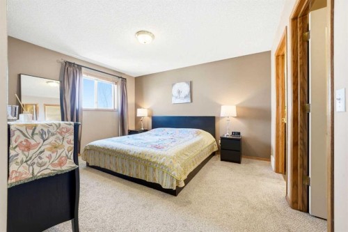 129 Arbour Ridge Circle Nw, Calgary, AB - Indoor Photo Showing Bedroom