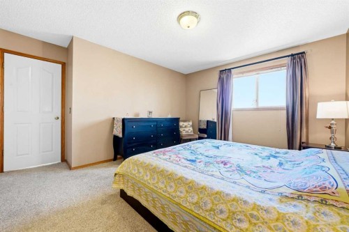 129 Arbour Ridge Circle Nw, Calgary, AB - Indoor Photo Showing Bedroom