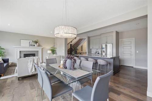 86 Panton View Nw, Calgary, AB - Indoor Photo Showing Dining Room With Fireplace