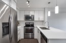 7309-302 Skyview Ranch Drive Ne, Calgary, AB  - Indoor Photo Showing Kitchen With Stainless Steel Kitchen With Double Sink With Upgraded Kitchen 