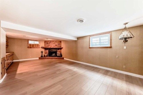 7427 25 Street Se, Calgary, AB - Indoor With Fireplace