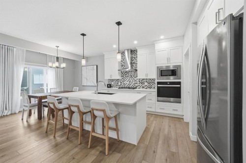 902 Bluerock Way Sw, Calgary, AB - Indoor Photo Showing Kitchen With Upgraded Kitchen