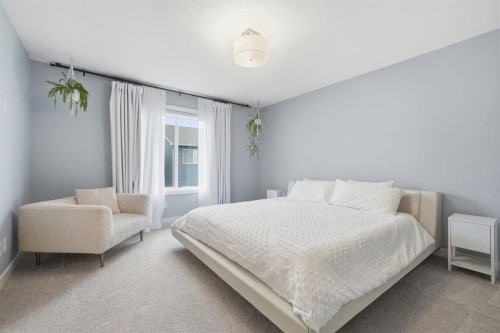 902 Bluerock Way Sw, Calgary, AB - Indoor Photo Showing Bedroom