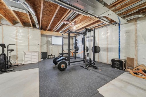 902 Bluerock Way Sw, Calgary, AB - Indoor Photo Showing Basement